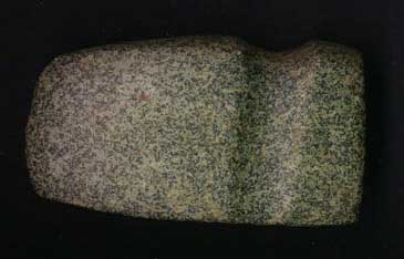 Photo of green granite axehead from the archaic period.